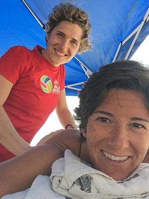 ACC Massage Therapy Program Director Kara Mirarchi poses for a photo with pro beach volleyball player Nicole Branagh
